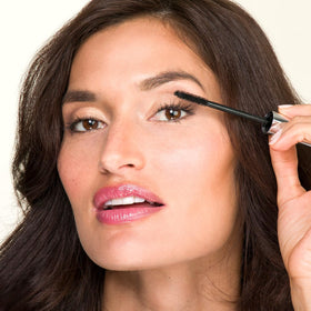 Lune+Aster Formidable Lengthening Mascara swatch displays jet-black color on skin.