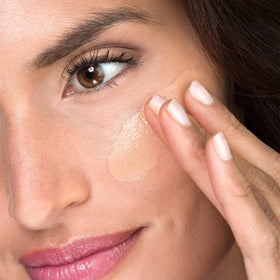 Lune+Aster RealGlow Primer application swatch demonstrating sheer glow and smooth texture