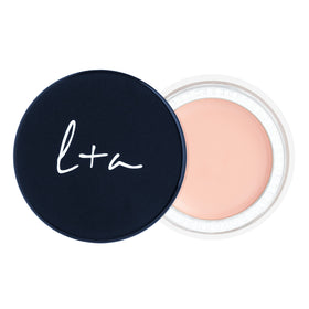 Lune+Aster Undereye Corrector balm closeup shows creamy texture for hydration.