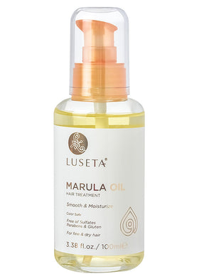 Luseta Marula Oil Hair Treatment bottle on display showing packaging and brand name with promise of shine
