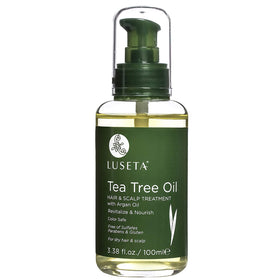 L Luseta Tea Tree Oil bottle pour for easy scalp nourishment and even distribution.