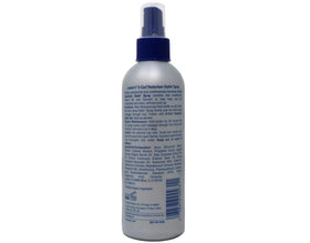 Luster's S-Curl hands applying spray for textured hair.