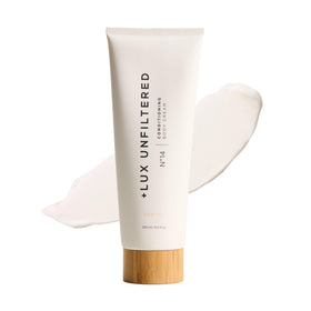 Lux Unfiltered Tall Pour N°14 bottle shows creamy texture for deep hydration.