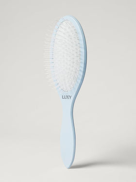 Luxy Loop Extensions Brush anti-static nylon bristles glide through extensions for smooth detangling