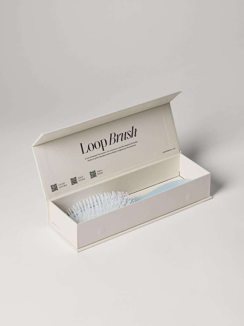 Luxy Loop Extensions Brush in use on hair lengths for quick, tangle-free styling