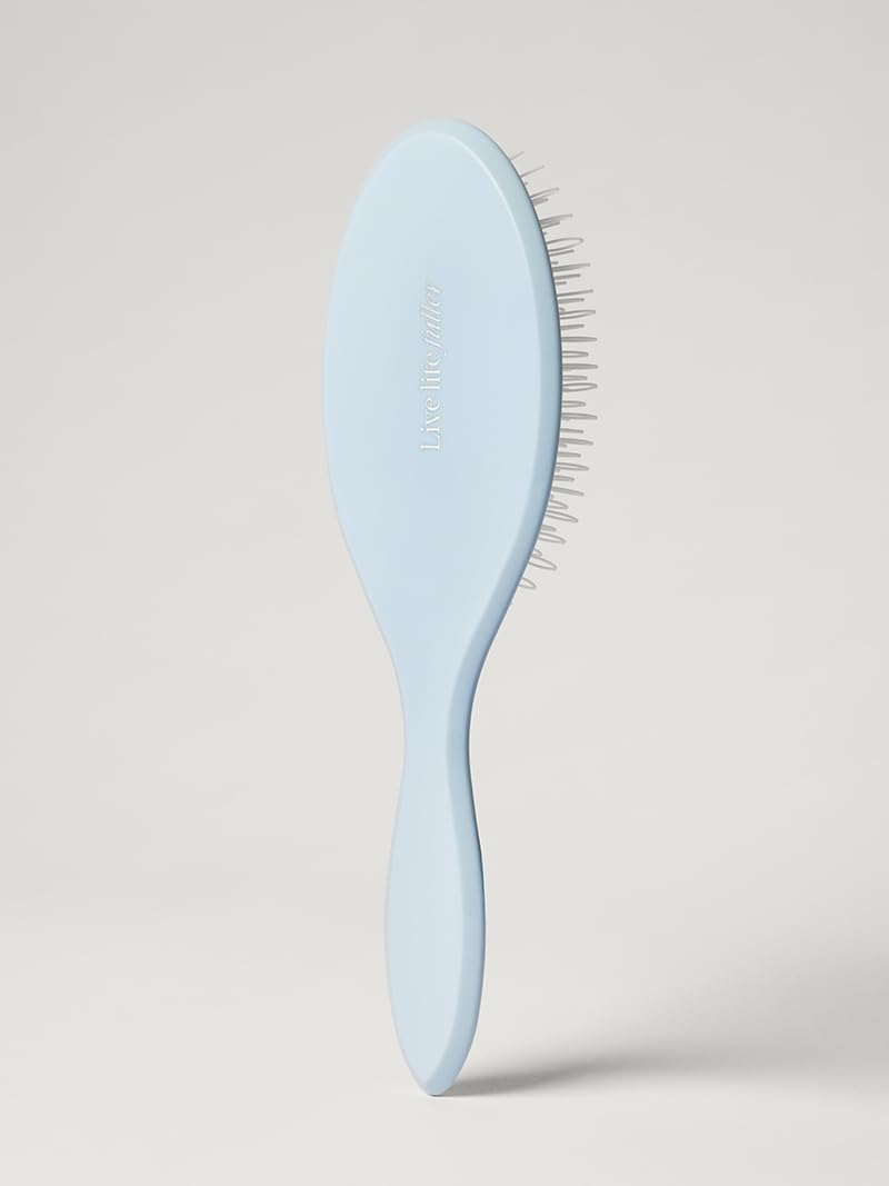 Luxy Loop Extensions Brush nylon loop bristles close-up showing gentle detangling on wefts