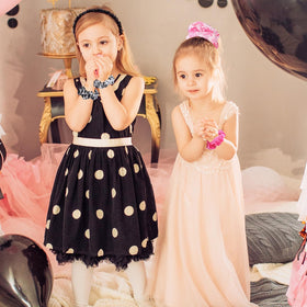Lyrow yellow cow-print scrunchie adds playful touch to outfits.