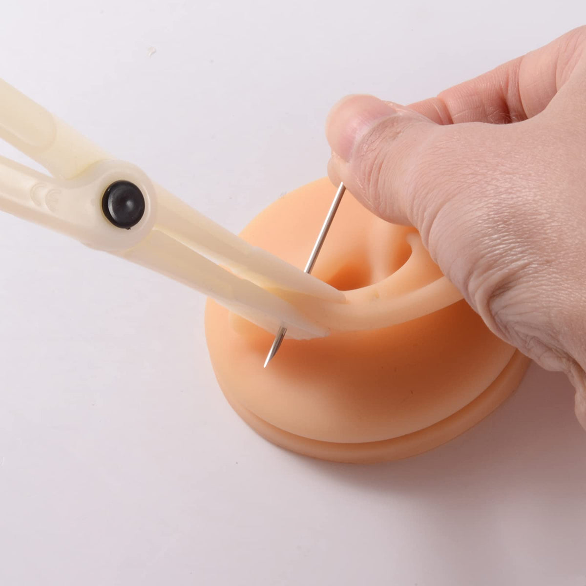 Lyuxzad kit showing multiple piercing applications ear nose septum.