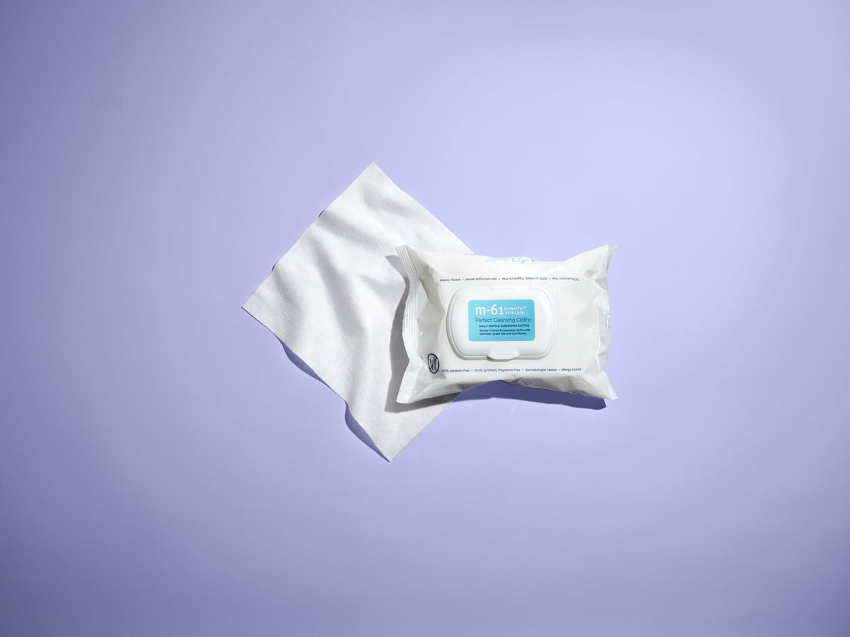 m-61 Perfect Cleansing Cloths being used on face: refreshing cleanse after makeup.
