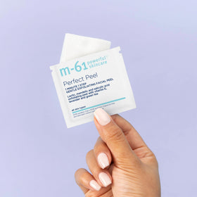 M-61 Perfect Peel flat lay with skincare lineup suggesting routine