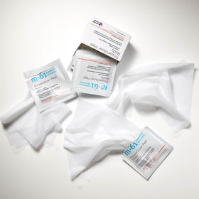 m-61 PowerGlow Peel Body towelette being applied by hand for easy use.