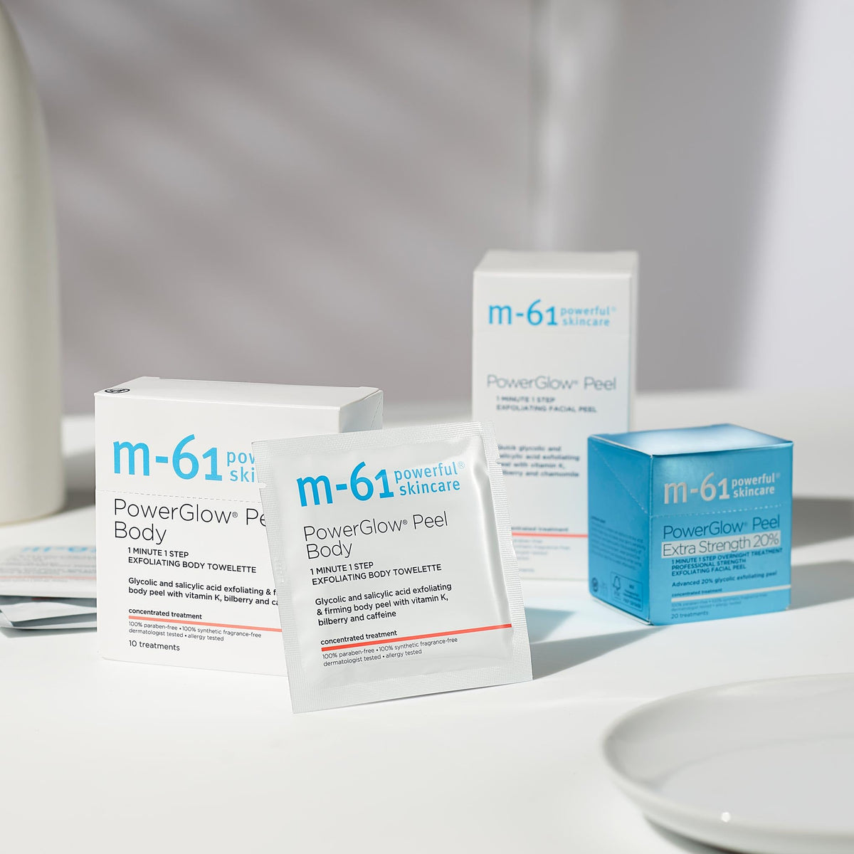 m-61 PowerGlow Peel Body towelette ingredients highlight glycolic acid and bilberry for smoother skin.