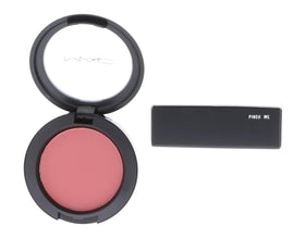 MAC Pinch Me swatch on cheek highlighting buildable color and blendability.