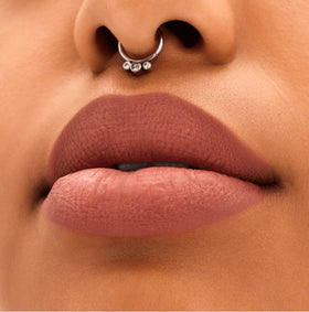 Close-up of matte texture from MAC Locked Kiss 24H Lipstick 61 Mischief.