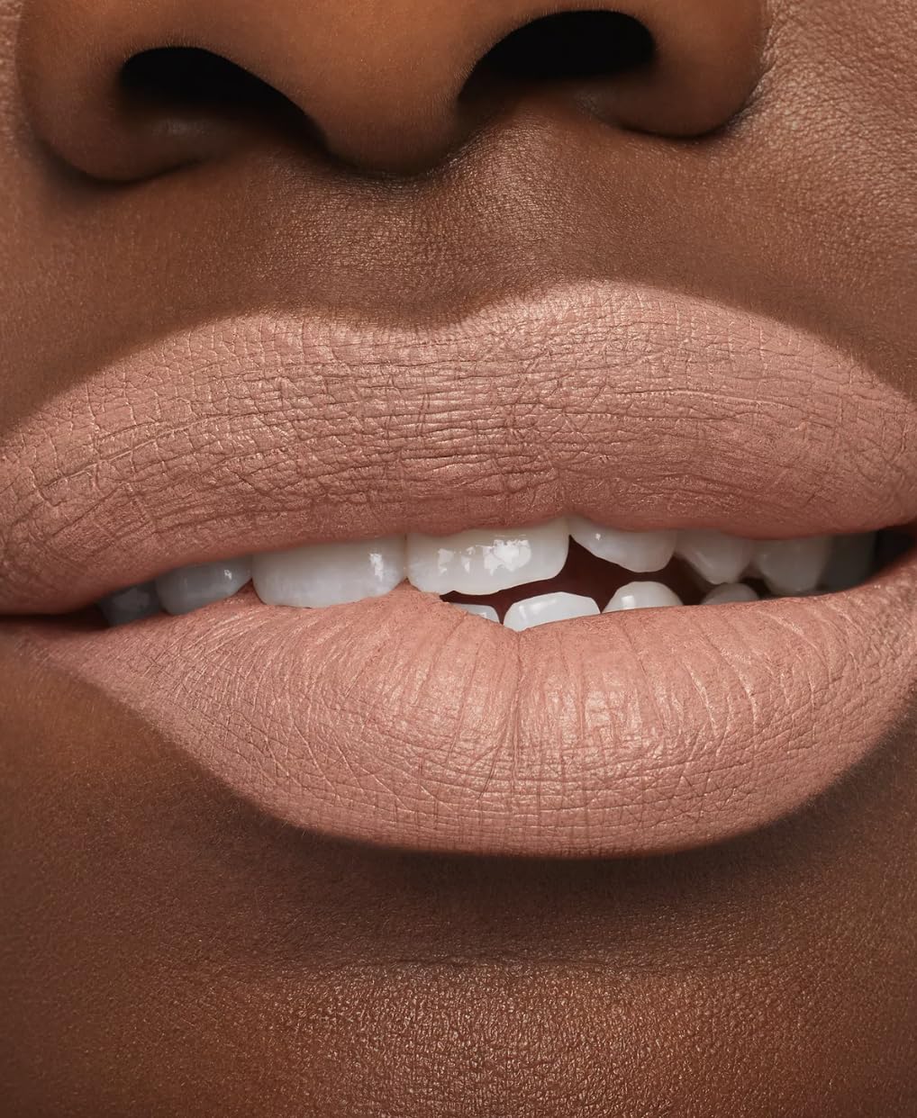 Close-up of lips with non-feathering finish in Honeylove-rose