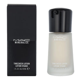 MAC Mineralize Timecheck Lotion bottle closeup with sleek packaging and premium feel.