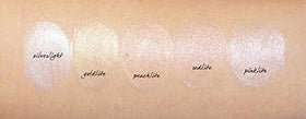 Close-up of MAC Strobe Cream Pink Lite cap highlighting a soft glow.