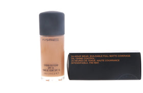 MAC Studio Fix Fluid bottle on vanity demonstrates ready-to-apply foundation