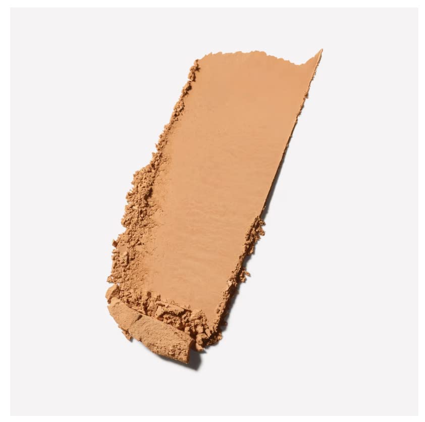 MAC Studio Fix Powder Plus Foundation NC46 close-up with brush demonstrates buildable coverage.