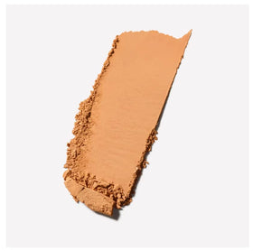 MAC Studio Fix Powder Plus Foundation NC46 close-up with brush demonstrates buildable coverage.