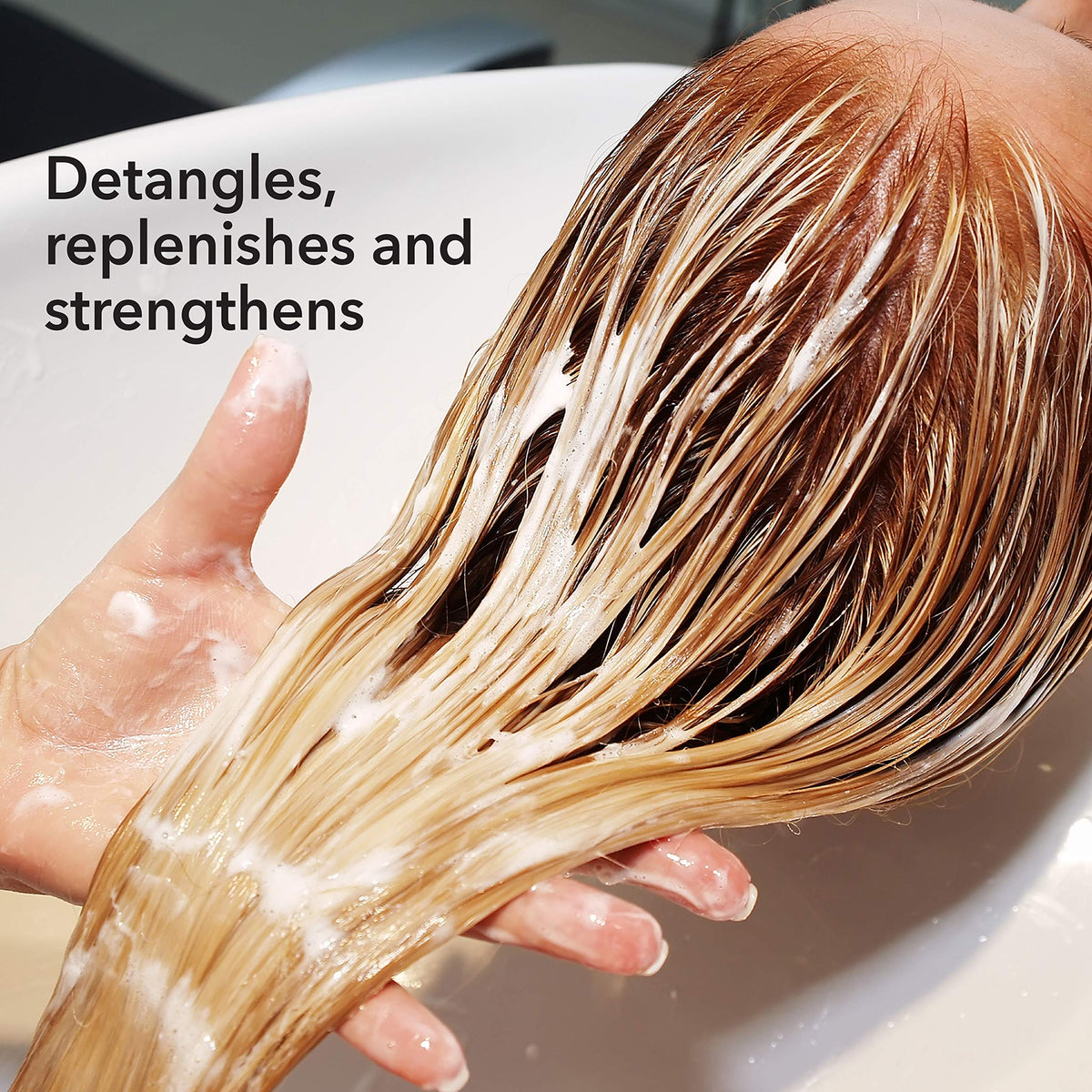 Macadamia Professional Weightless Repair Conditioner cream texture enriching fine hair.