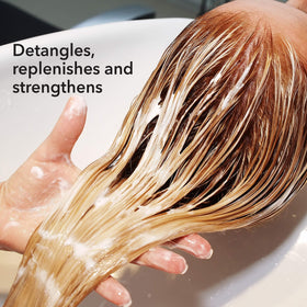 Macadamia Professional Weightless Repair Conditioner cream texture enriching fine hair.