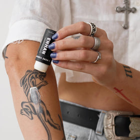 Mad Rabbit Enhance Tattoo Balm Stick portable for on-the-go touch-ups and tattoo care.