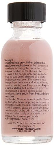 M.A.D Skincare Acne Drying Lotion being dabbed onto a blemish for precise treatment.