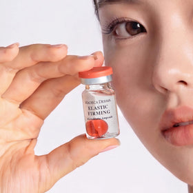 Madeca Derma Elastic Firming Ampoule bottle with pump for easy application.