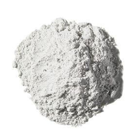 Magic Skin Conditioning Shaving Powder being mixed with water to form a smooth paste.