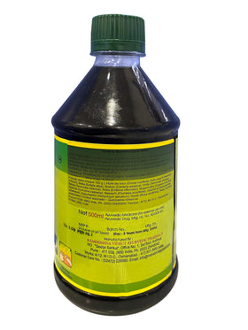 Mahabhringaraj Oil applied to scalp during massage demonstration for relaxation.