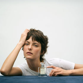 Lifestyle image of Maison Louis Marie perfume applied to wrists for daily lift.