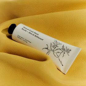 Maison Louis Marie No.04 Bois De Balincourt hand cream texture shown, hinting at rich hydration.