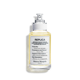 Maison Margiela Replica Afternoon Delight bottle showing warm vanilla and sandalwood notes.