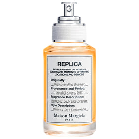Maison Margiela Replica Never Ending Summer bottle pour highlights fresh citrus aroma.