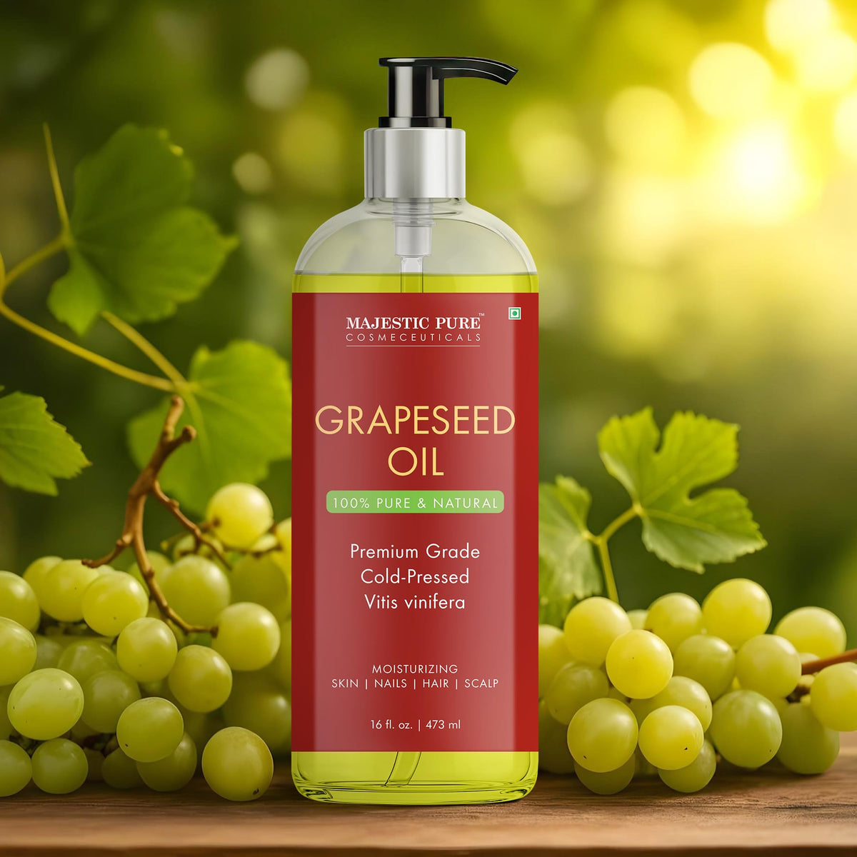 Hands holding Majestic Pure Grapeseed Oil bottle, ready for multi-use care.