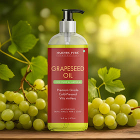 Hands holding Majestic Pure Grapeseed Oil bottle, ready for multi-use care.