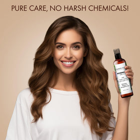Majestic Pure rosemary oil on hair for hydration and shine