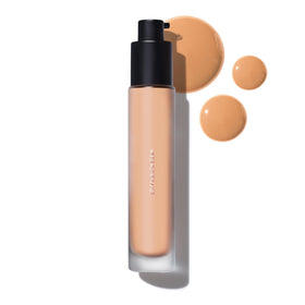 MAKE Beauty Skin Tint Diffusion Dew bottle highlights natural radiance for even tone.