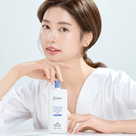 Hand applying MAKEP:REM Defense Me sunscreen on the face during outdoor activity