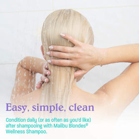 Malibu C bottle beside towel ready for at-home conditioning routine