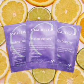 Malibu C Blondes Wellness Remedy applied to damp hair for enhanced moisture and shine.