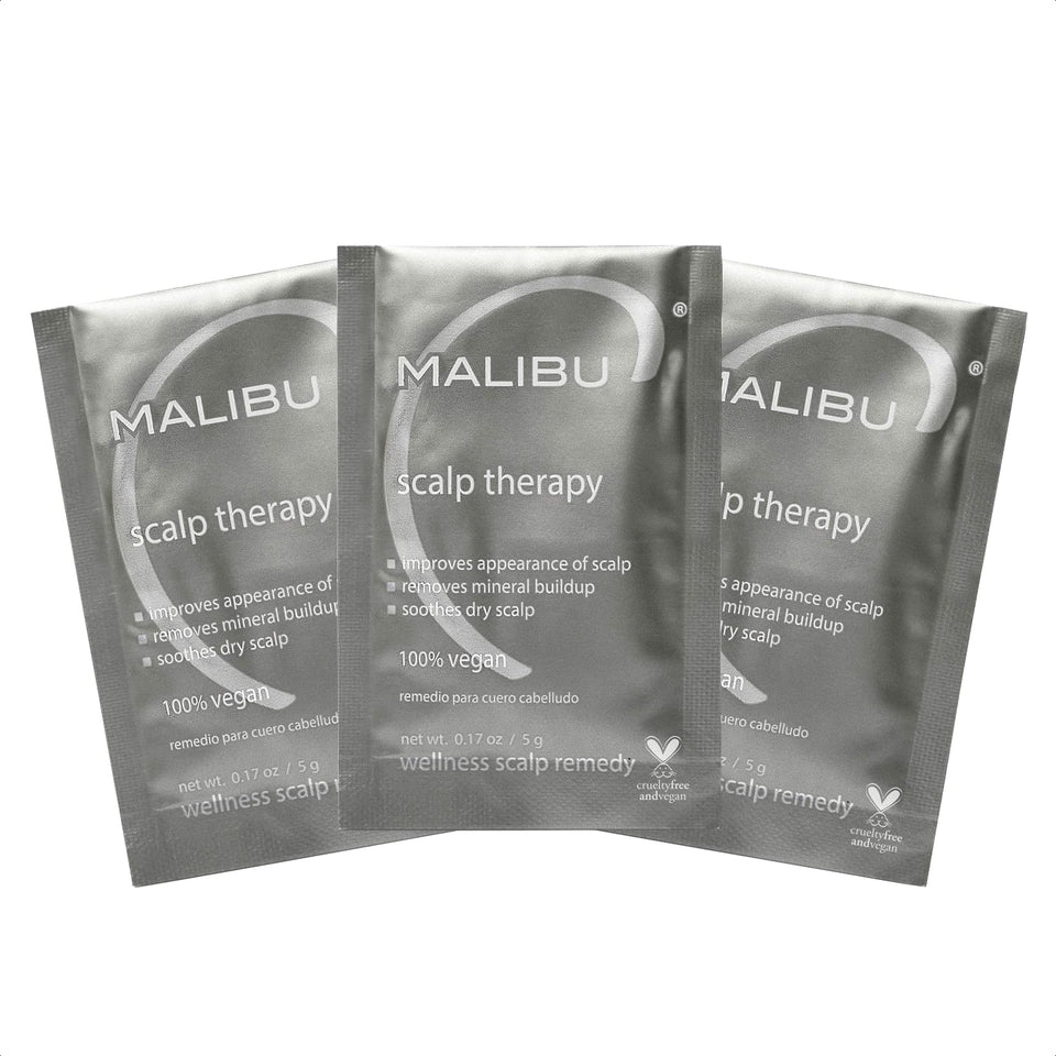 Malibu C Scalp Therapy crystals dissolving in hand for soothing scalp treatment