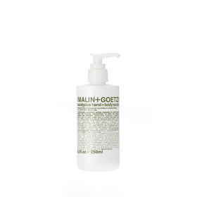 MALIN+GOETZ Eucalyptus Hand+Body Scrub bottle ready for a refreshing cleanse