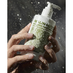 Close-up of scrub texture showing fine pumice and AHAs for gentle exfoliation