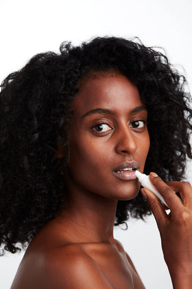 MALIN+GOETZ lip balm spearmint refreshing application outdoors