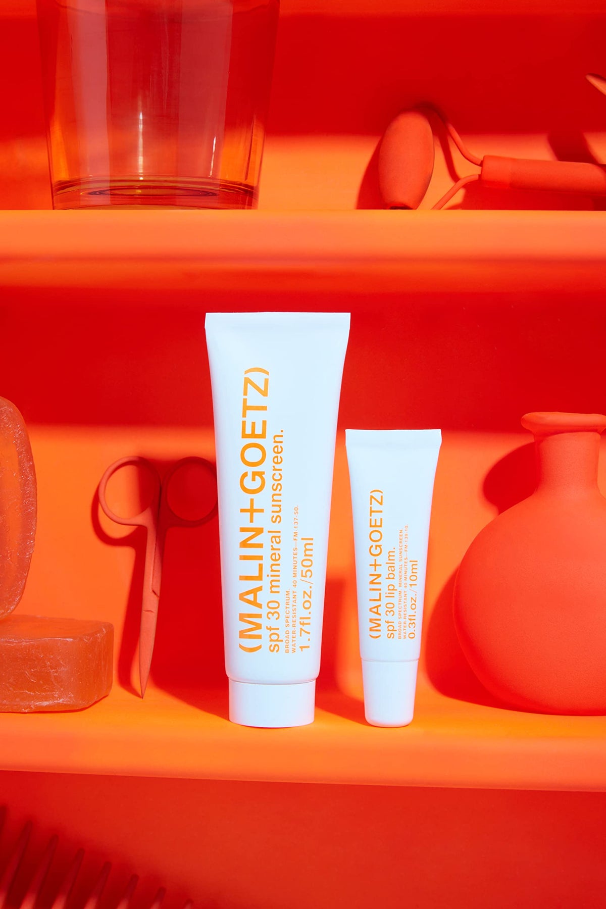Texture swatch of MALIN+GOETZ SPF 30 lip balm for smooth feel