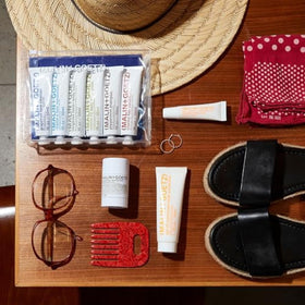 MALIN+GOETZ packaging with pump for travel-ready sun protection.