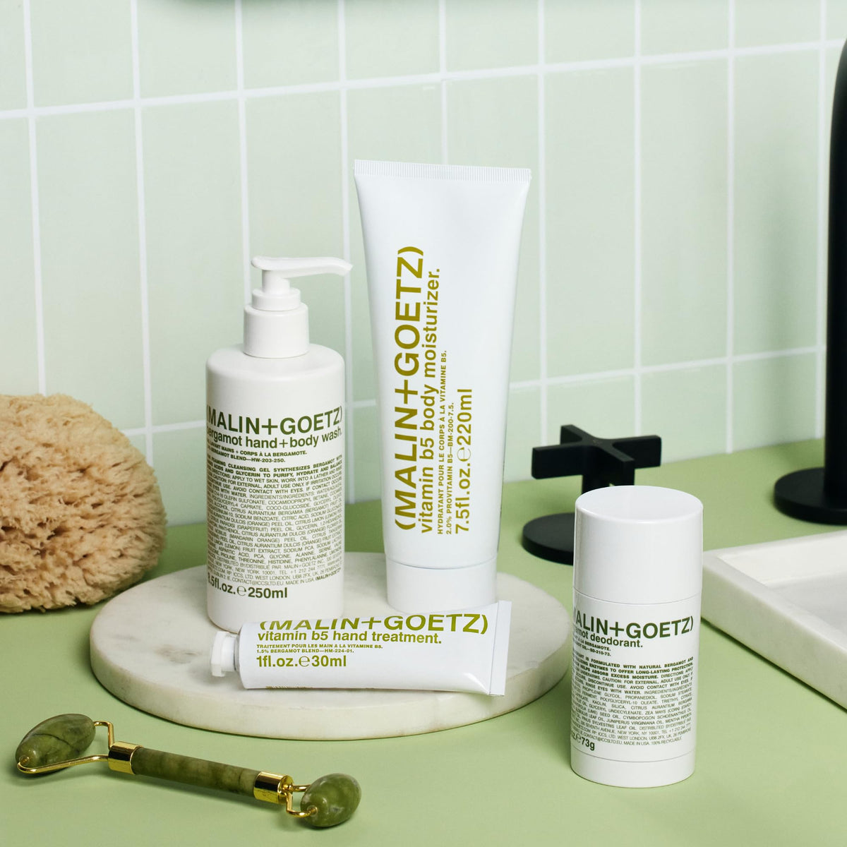 MALIN+GOETZ Vitamin B5 body moisturizer packaging display.