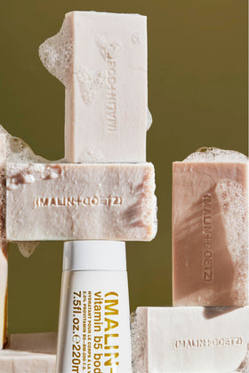 MALIN+GOETZ Vitamin B5 Hydrating Bar Rum fragrance swirl conveying warm, luxurious scent
